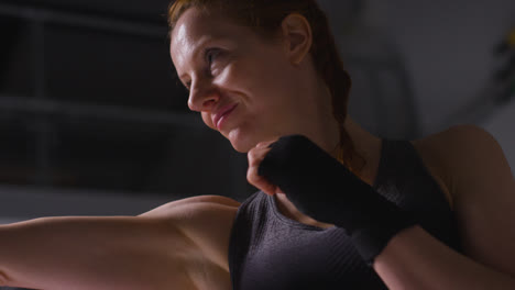 Close-Up-Shot-Of-Mature-Woman-Wearing-Gym-Fitness-Clothing-Exercising-Sparring